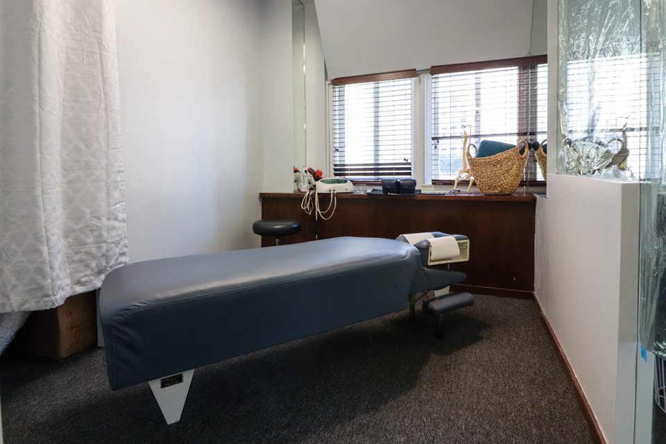 A treatment room with an adjusting table